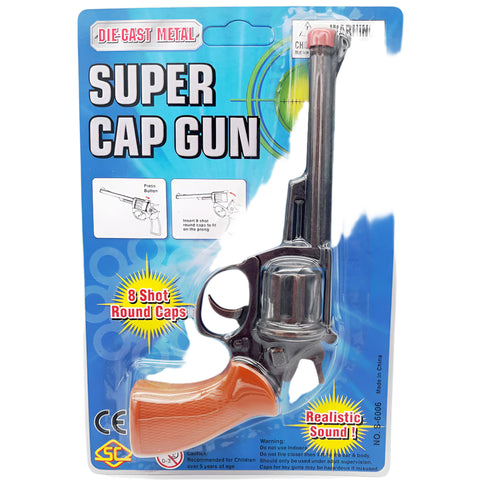Toy cap gun in packaging with blue background
